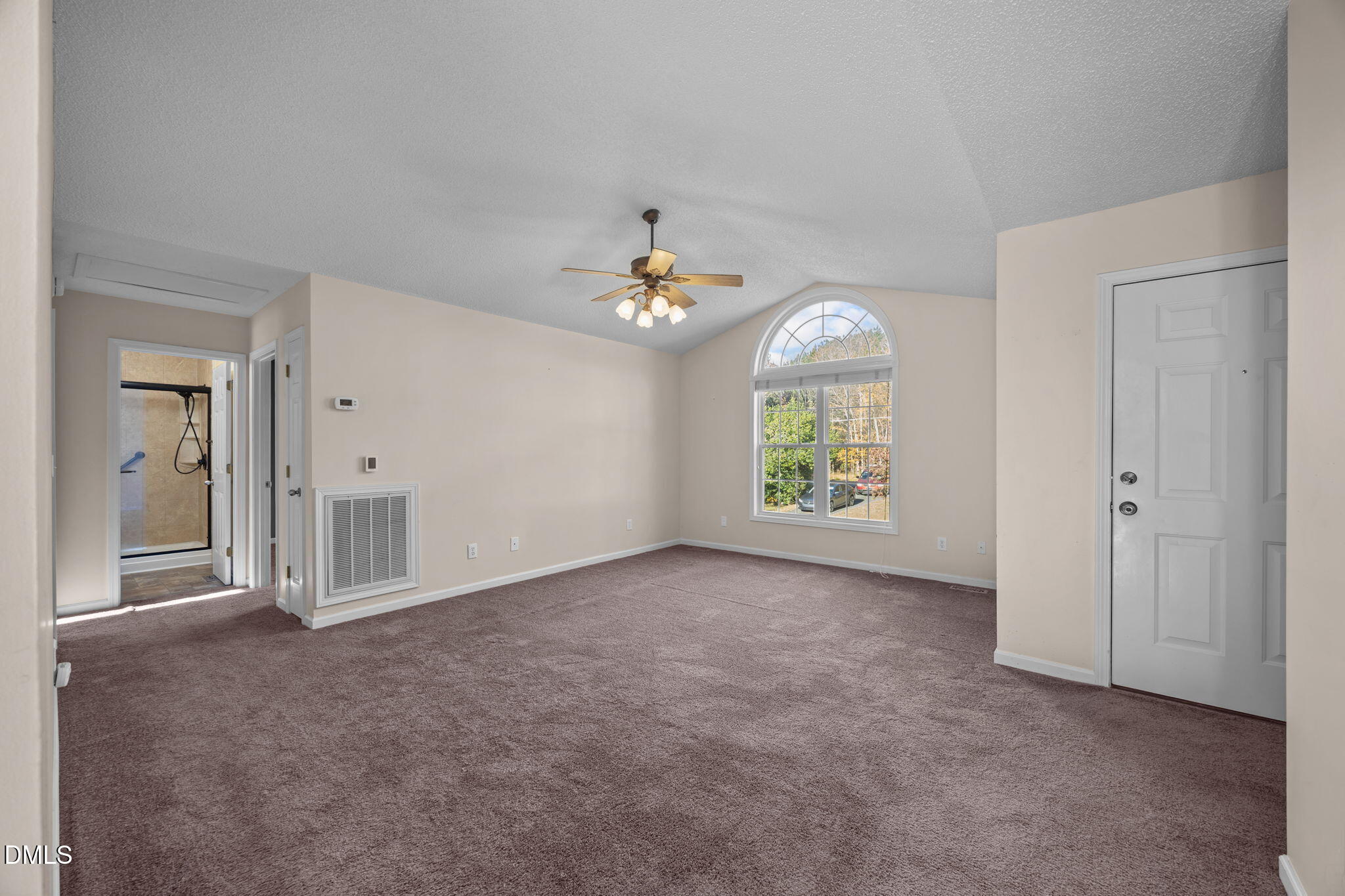 2267 South Jim Minor Road Haw River, NC 27258 - Photo 7 of 36 an empty room with windows and chandelier