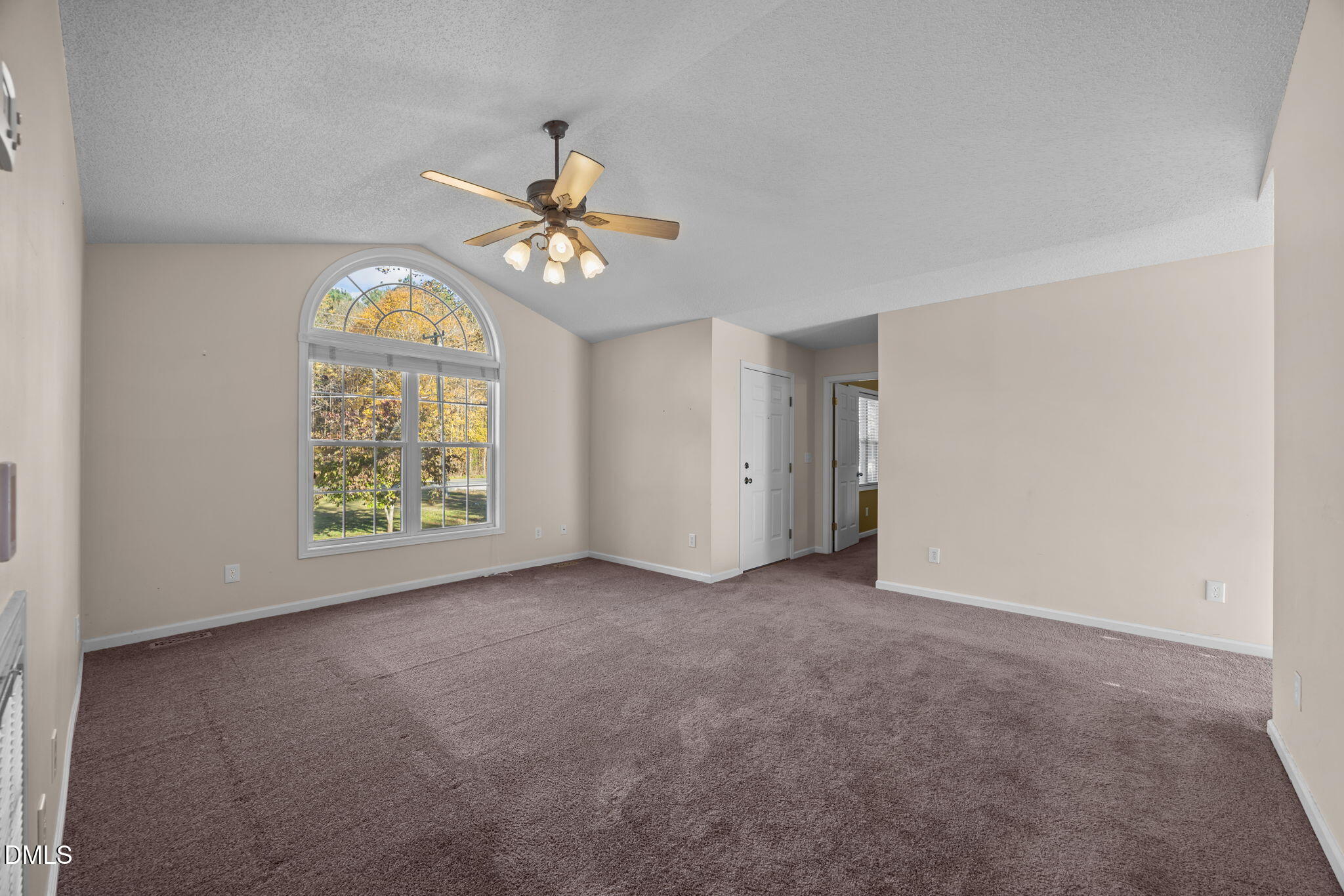 2267 South Jim Minor Road Haw River, NC 27258 - Photo 8 of 36 an empty room with a window and a ceiling fan