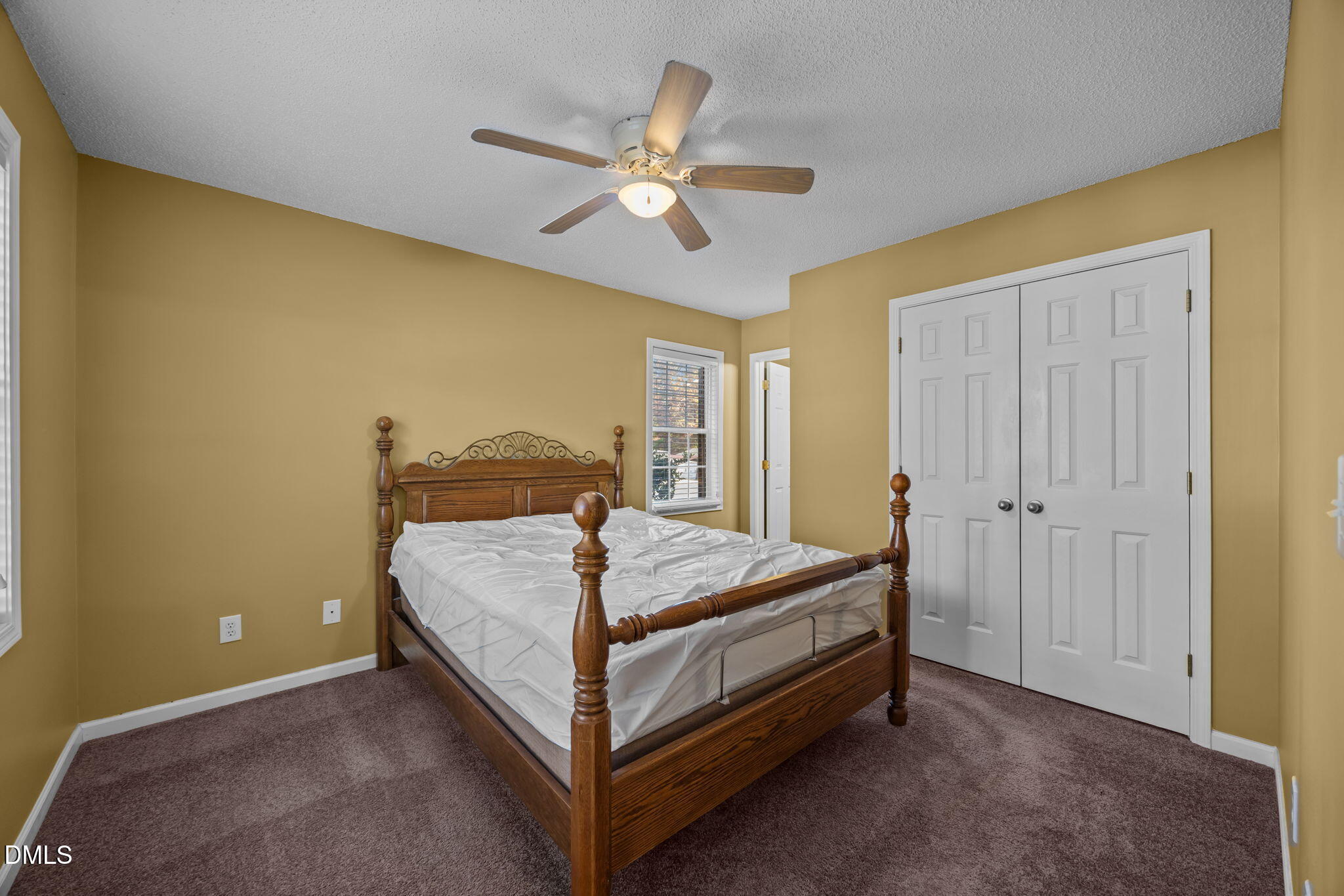 2267 South Jim Minor Road Haw River, NC 27258 - Photo 9 of 36 a bed sitting in a spacious bedroom next to a window