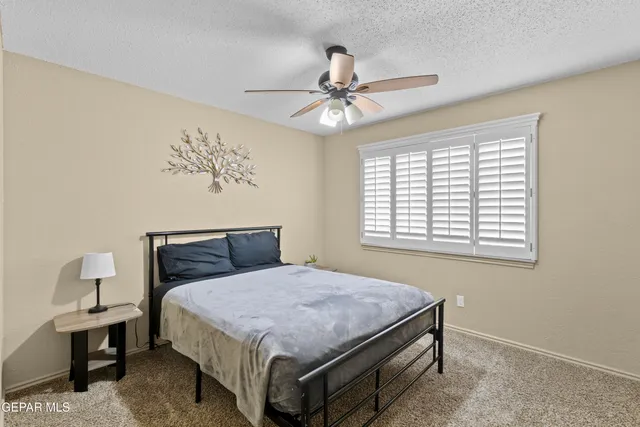 a view of a chairs and table in patio with a garden