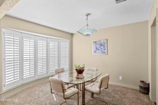 a kitchen with stainless steel appliances a sink a stove and a refrigerator