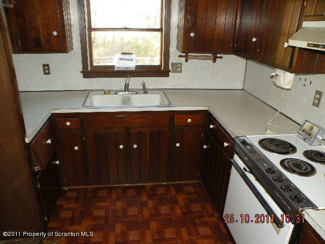 2136 Ross Road Dalton, PA 18414 - Photo 4 of 9 a bathroom with a sink a vanity and a mirror