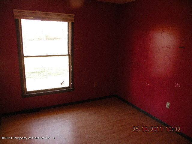 2136 Ross Road Dalton, PA 18414 - Photo 5 of 9 an empty room with a window