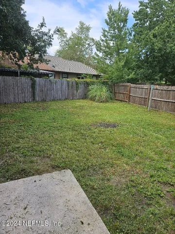 a view of a backyard with a garden