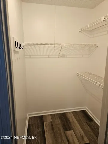 a view of a room with racks on the wall