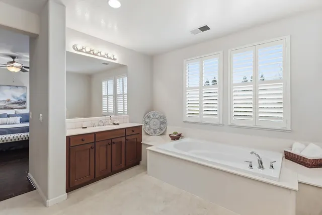 a room with pool table and windows