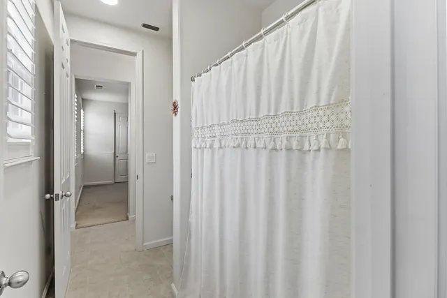 a view of a street with houses on both side