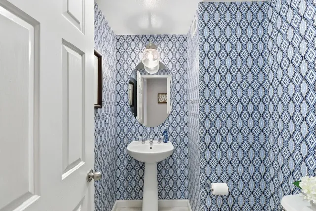 a outdoor space with lots of tables a chairs and a book shelf