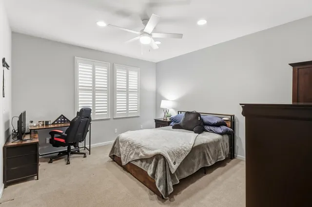 a view of a swimming pool and a patio