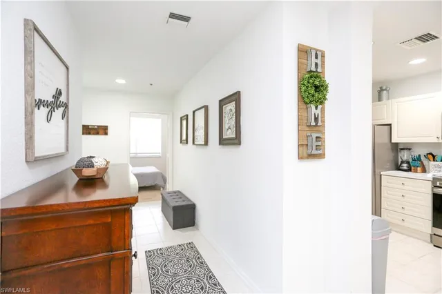 a kitchen with a sink cabinets and window