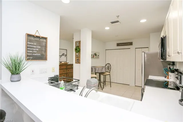 a view of a living room and kitchen