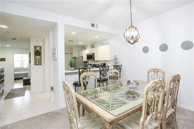 a view of a dining room and chandelier