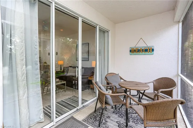 a view of a room that has a table and chairs in it