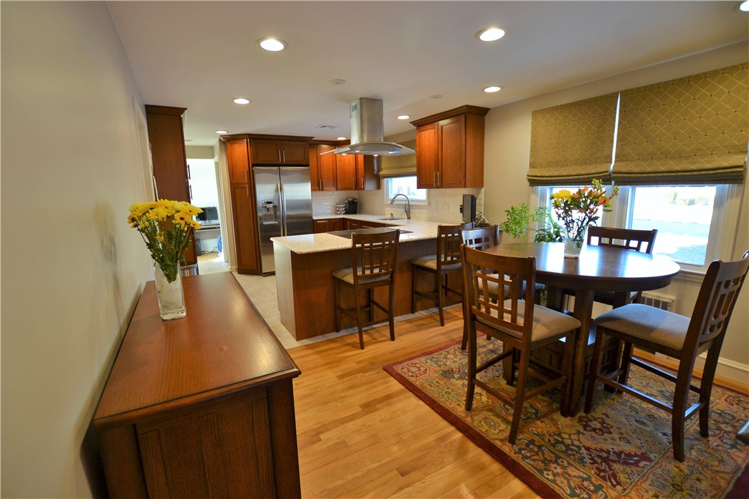 11 Fielding Road Cranston, RI 02910 - Photo 6 of 32 Open Kitchen and Dining with Gleaming Hardwoods, Recessed Lighting and Custom Roman Shades