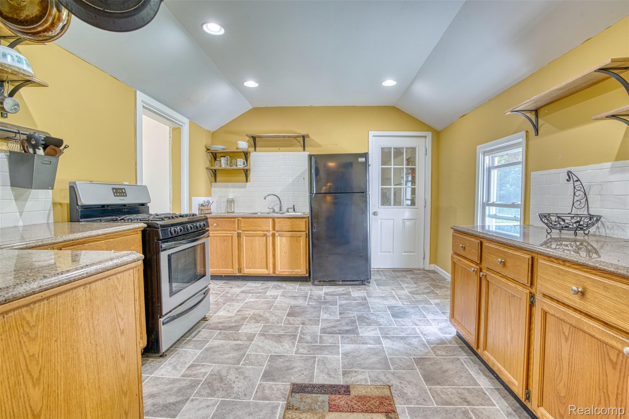 2980 Baseline Road Stockbridge, MI 49285 - Photo 11 of 28 Mud room off of the kitchen, 2 additonal entrances and bonus room off of the kitchen waiting for your finishing touches and vision.