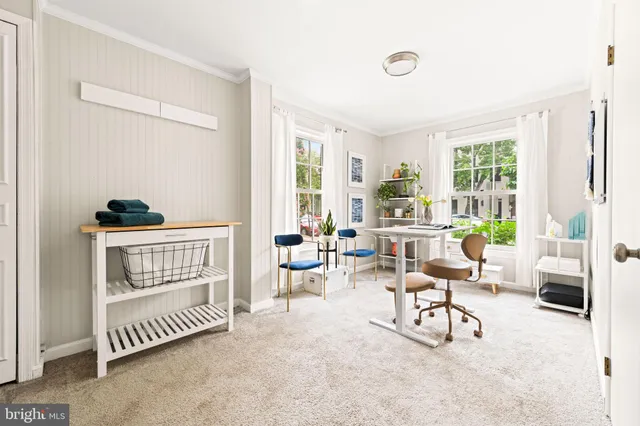 a backyard of a house with a garden and plants