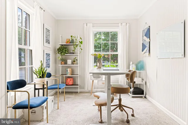 a bathroom with a sink and flowers