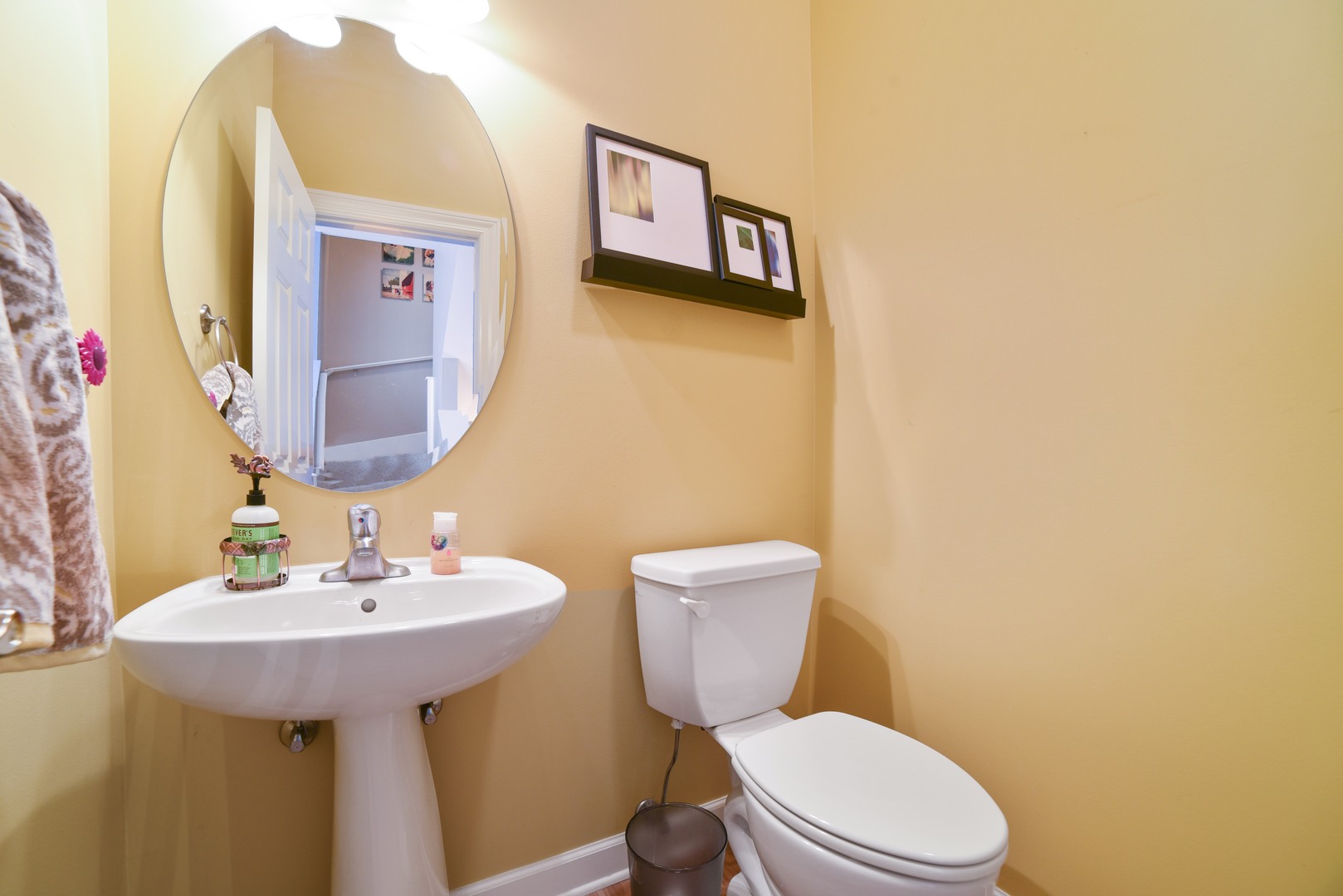 155 Dawson Drive Elgin, IL 60120 - Photo 12 of 13 a bathroom with a toilet sink and mirror