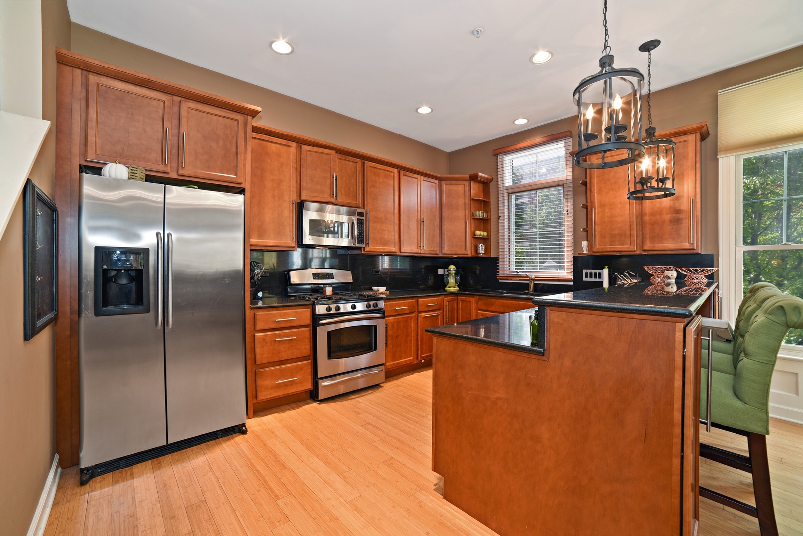 155 Dawson Drive Elgin, IL 60120 - Photo 3 of 13 a kitchen with stainless steel appliances granite countertop a refrigerator a stove top oven a sink and dishwasher