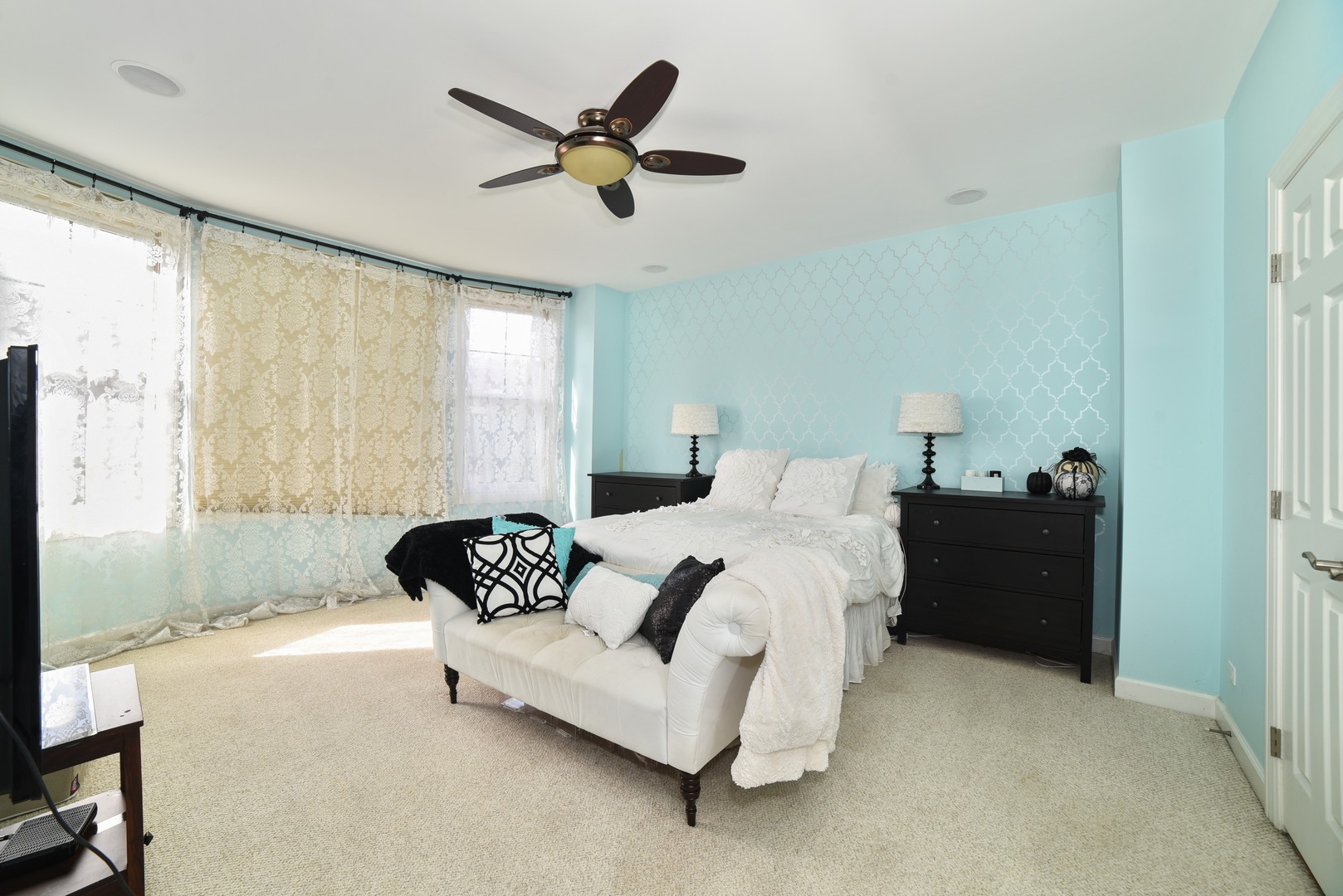 155 Dawson Drive Elgin, IL 60120 - Photo 6 of 13 a spacious bedroom with a bed and a chandelier