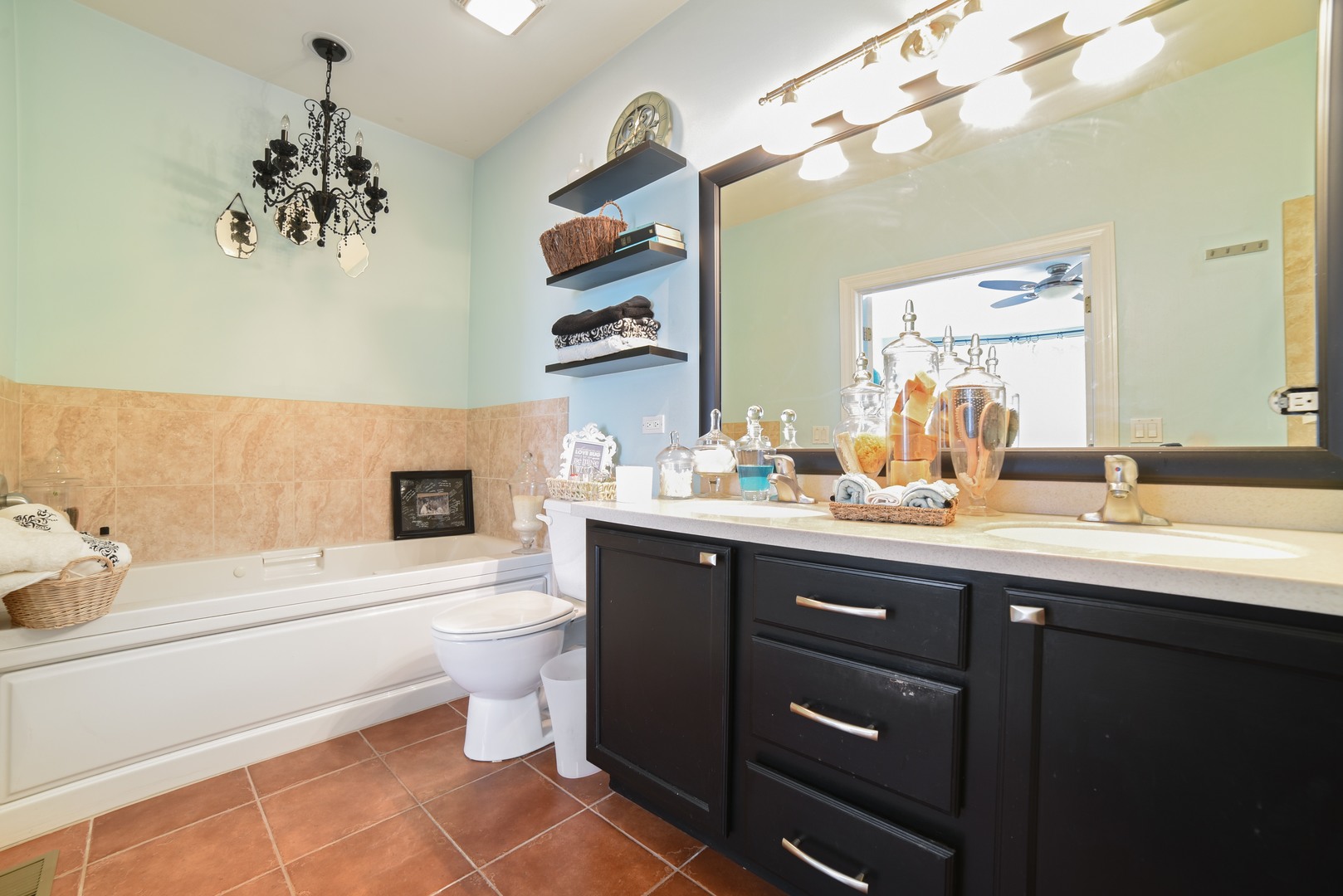 155 Dawson Drive Elgin, IL 60120 - Photo 8 of 13 a bathroom with a sink a toilet and a mirror