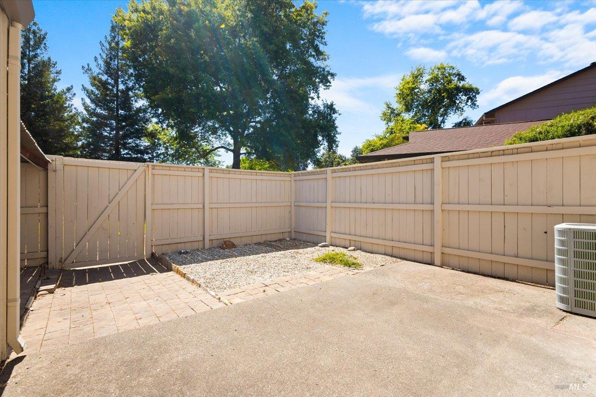 303 Algiers Court Santa Rosa, CA 95409 - Photo 23 of 27 Roomy patio and space for a playset, garden beds, or more relaxing.