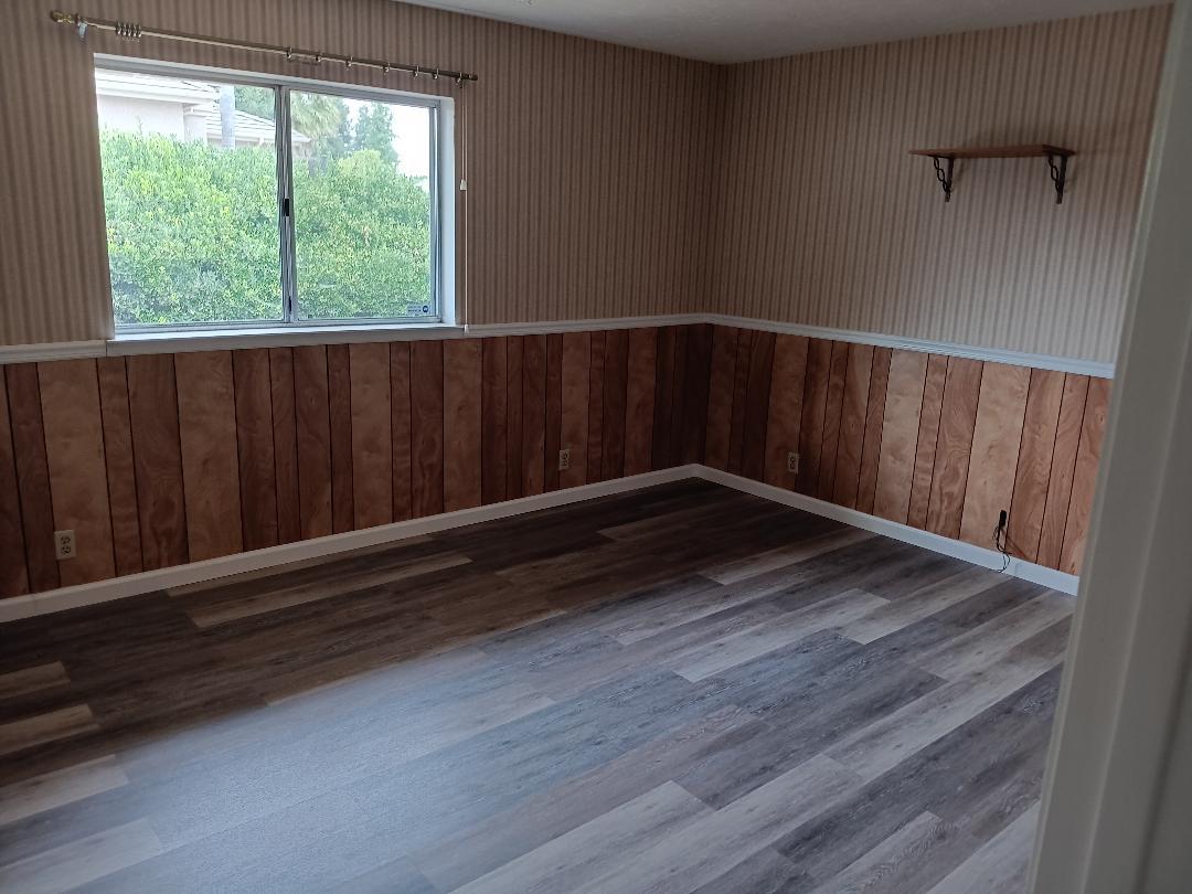 19324 Farallon Road Madera, CA 93638 - Photo 5 of 10 a view of a small space with wooden floor and a window