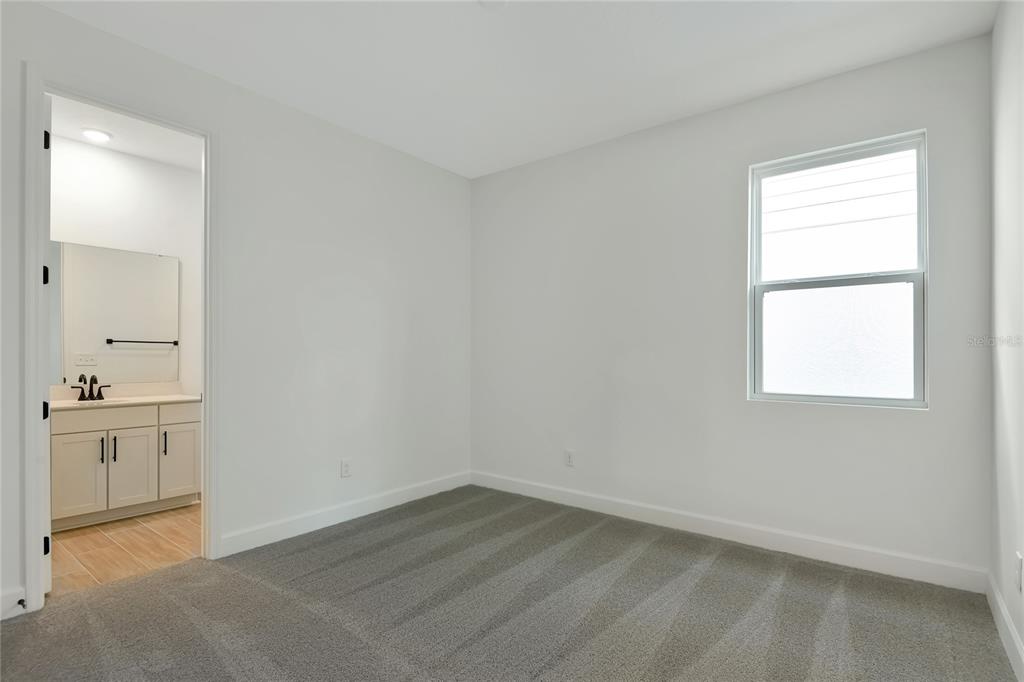 145 Waterstone Loop Tavares, FL 32778 - Photo 13 of 16 an empty room with a window