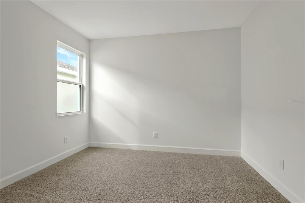 145 Waterstone Loop Tavares, FL 32778 - Photo 5 of 16 an empty room with a window