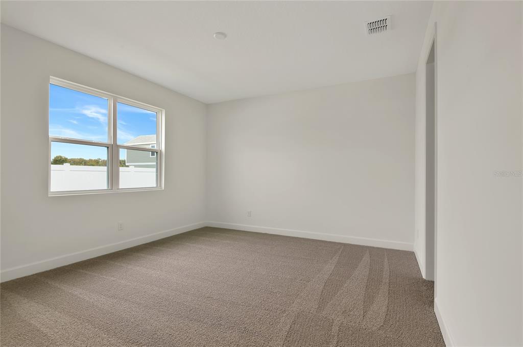 145 Waterstone Loop Tavares, FL 32778 - Photo 10 of 16 an empty room with a window
