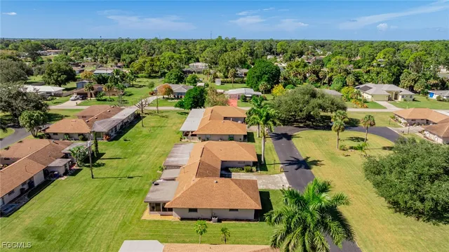 an aerial view of a house with a lake view