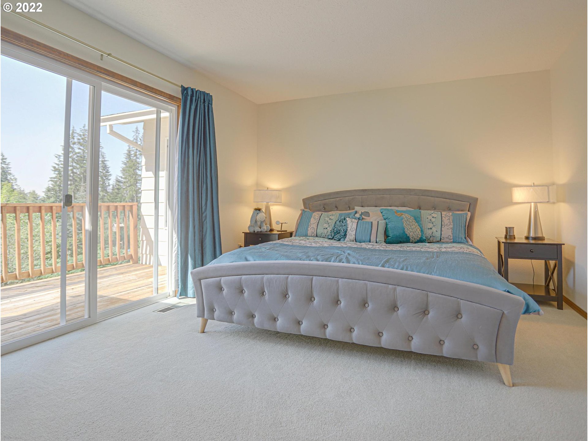 43370 Southeast Pagh Road Sandy, OR 97055 - Photo 13 of 29 a bedroom with a bed and a large window