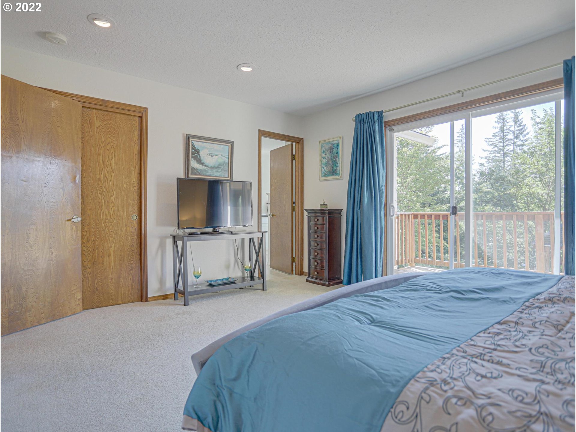 43370 Southeast Pagh Road Sandy, OR 97055 - Photo 14 of 29 a bedroom with a bed and a large window