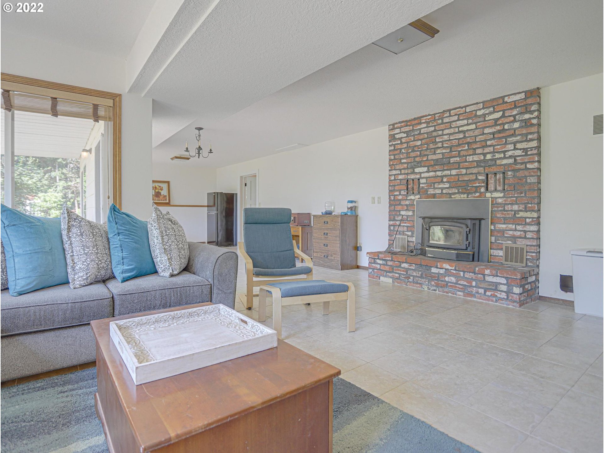 43370 Southeast Pagh Road Sandy, OR 97055 - Photo 19 of 29 a living room with furniture and a fireplace