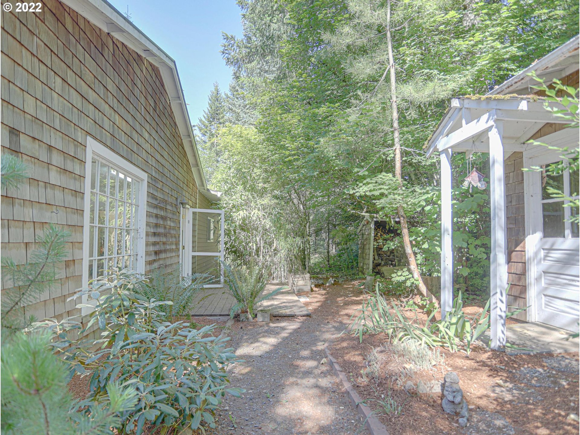 43370 Southeast Pagh Road Sandy, OR 97055 - Photo 23 of 29 a view of a house with backyard and garden