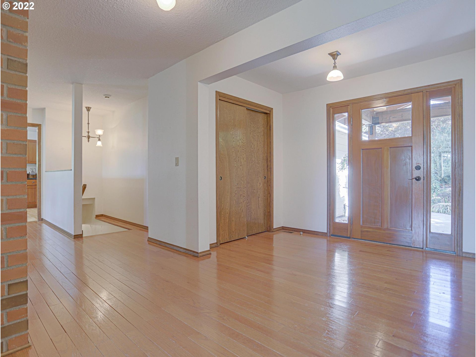 43370 Southeast Pagh Road Sandy, OR 97055 - Photo 4 of 29 an empty room with wooden floor and windows