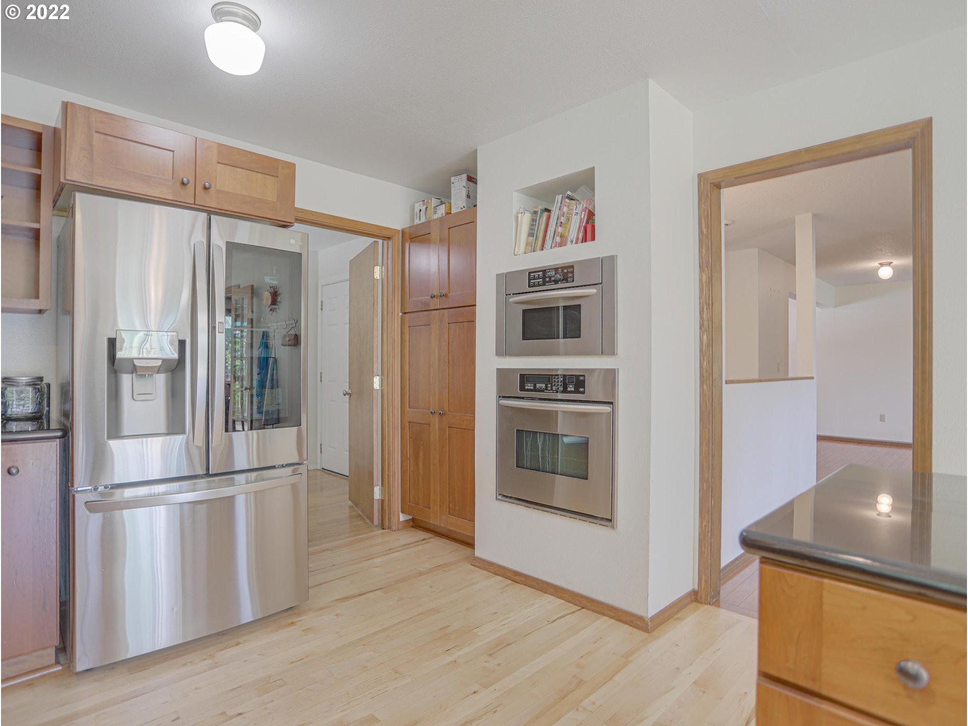 43370 Southeast Pagh Road Sandy, OR 97055 - Photo 6 of 29 a kitchen with stainless steel appliances a refrigerator and a stove top oven