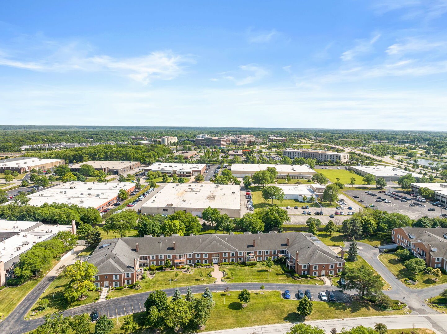 124 Carriage Way Drive, Unit B109 Burr Ridge, IL 60527 - Photo 28 of 31 an aerial view of residential building and lake view