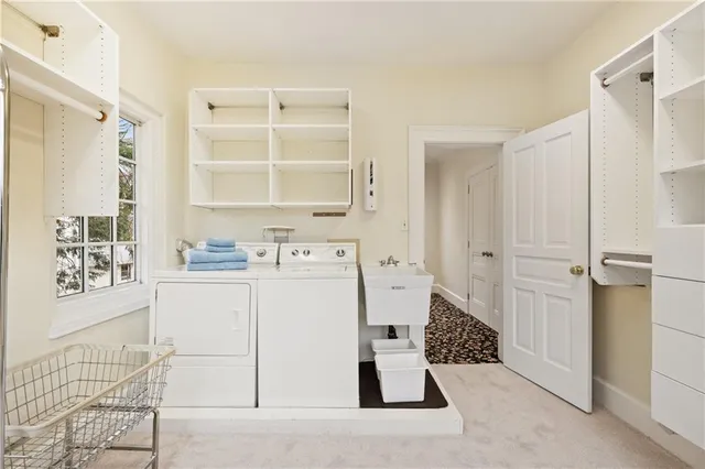 a spacious bedroom with a large bed and a fireplace