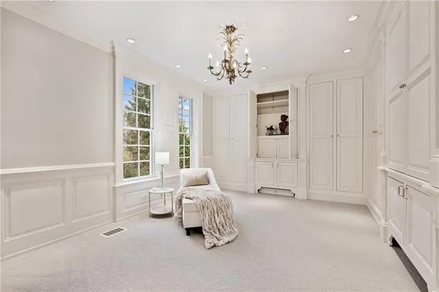 a bedroom with a bed and lamp