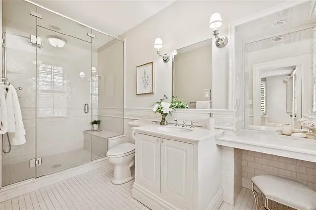 a spacious bedroom with a bed and a couch