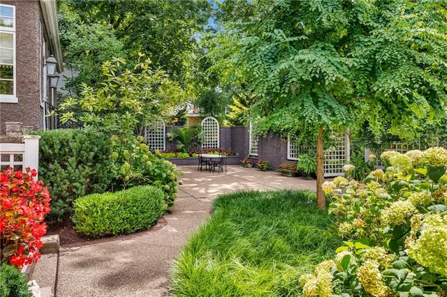 a view of a house with a tree