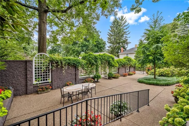 a view of a house with potted plants