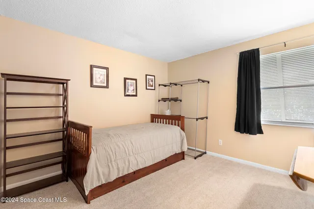 a bedroom with a bed and a cabinets