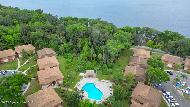 an aerial view of a house with outdoor space and street view