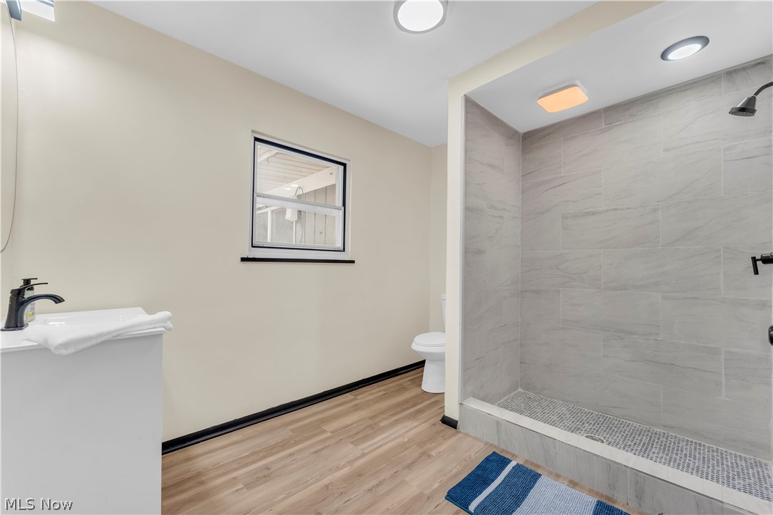 7320 Avon Belden Road North Ridgeville, OH 44039 - Photo 26 of 33 Full bathroom featuring a shower stall and light wood-style flooring