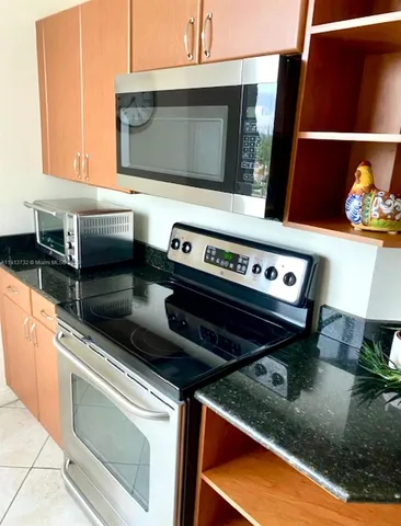 a kitchen with a stove and a microwave