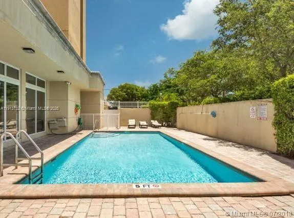 swimming pool view with a outdoor seating