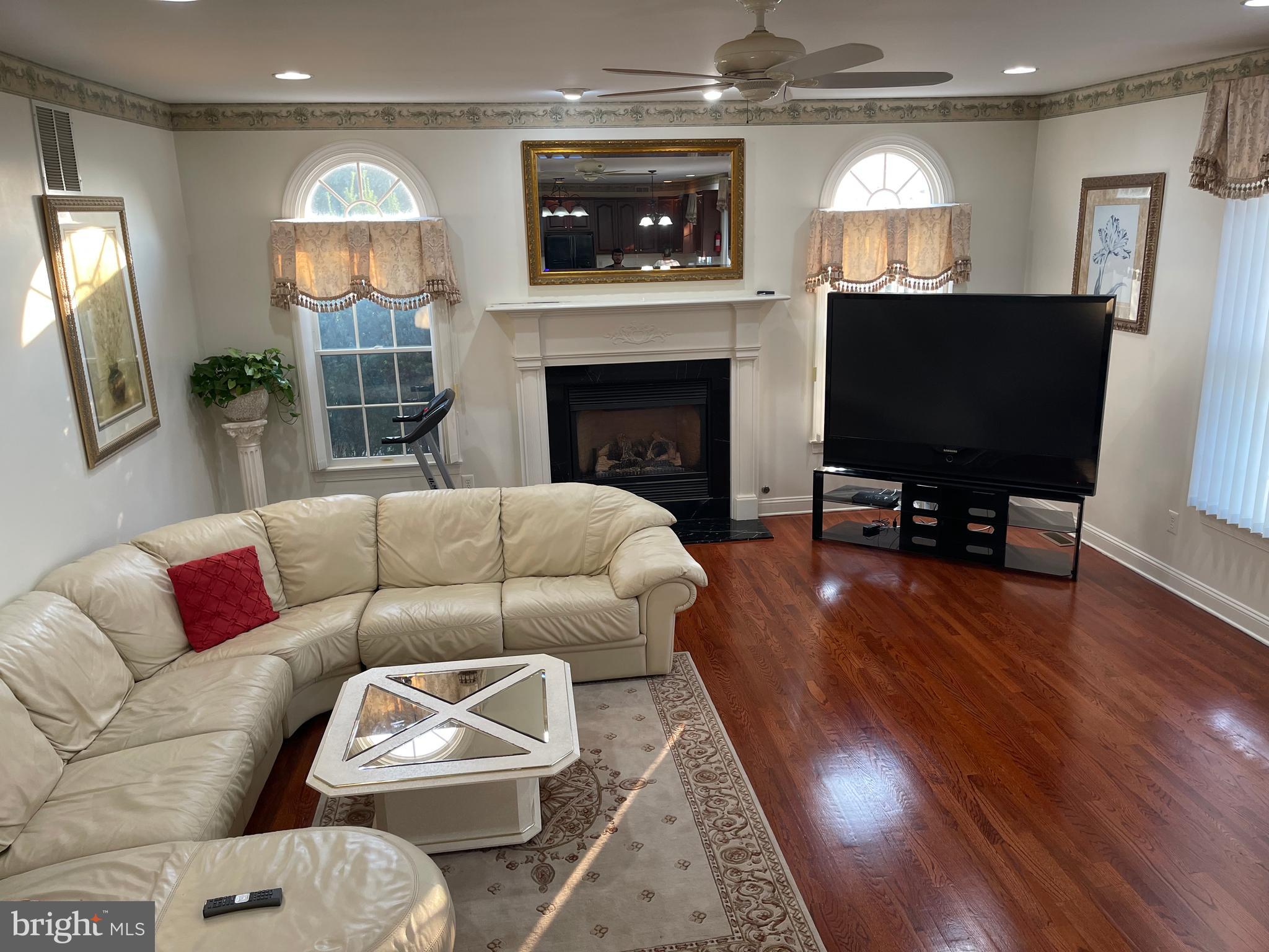 18 Jewel Road Princeton Junction, NJ 08550 - Photo 23 of 66 a living room with furniture and a fireplace