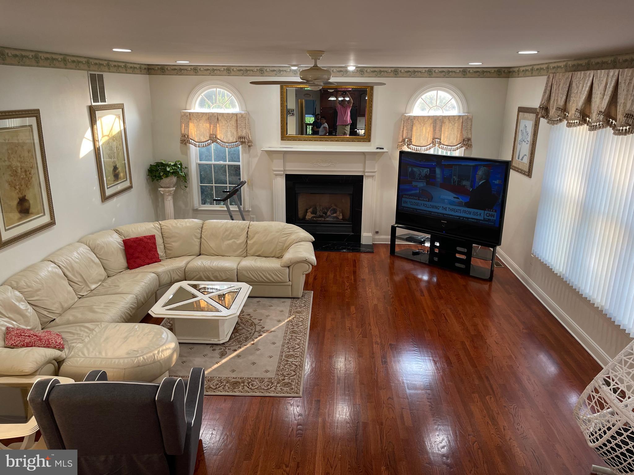 18 Jewel Road Princeton Junction, NJ 08550 - Photo 24 of 66 a living room with furniture and a fireplace